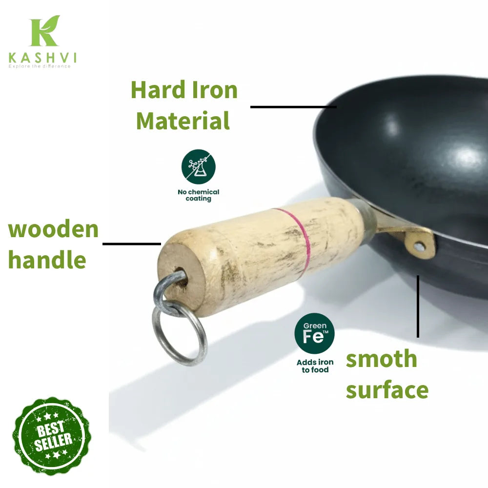 Black wok with wooden handle labeled 'Kashvi' on a white background