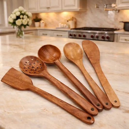 Set of wooden cooking utensils on a kitchen counter