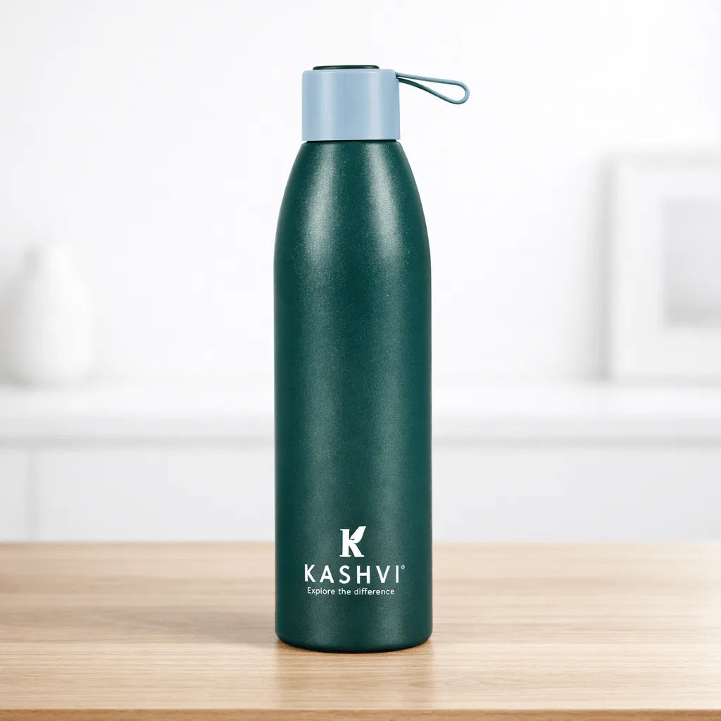 Green water bottle with a light blue cap on a wooden surface