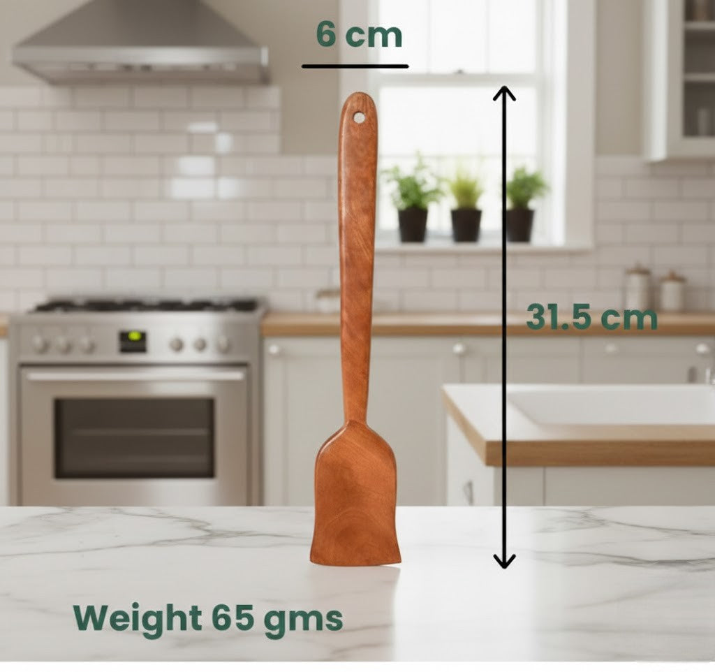 Wooden spatula with measurements on a kitchen counter