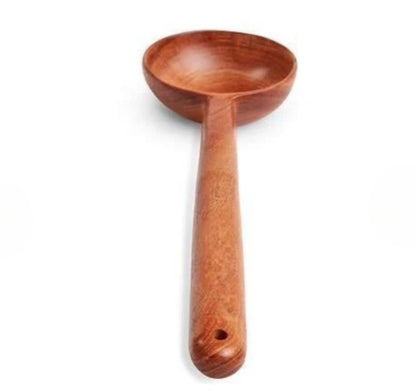 Wooden ladle on a white background