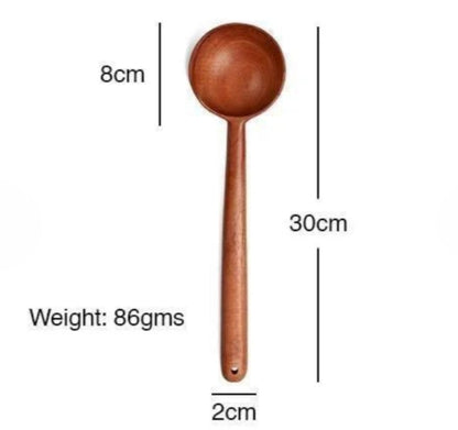 Wooden spoon with measurements on a white background