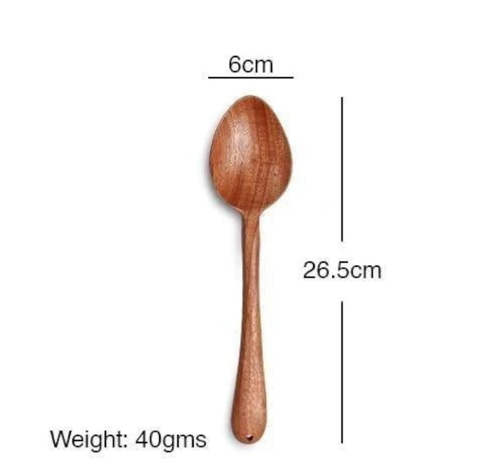 Wooden spoon with measurements on a white background